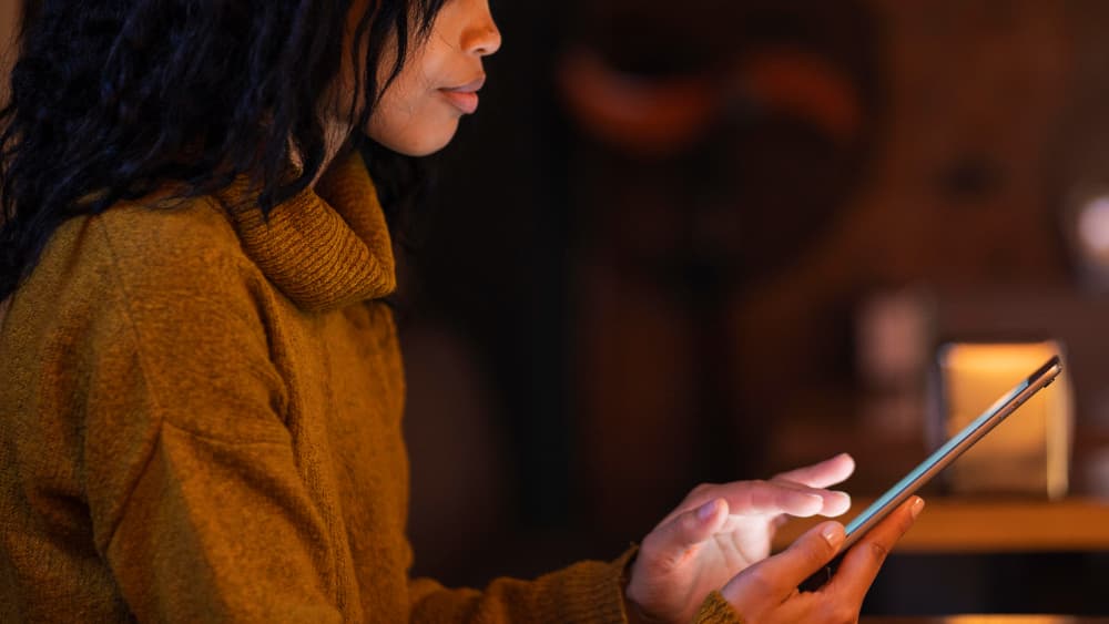 A lady reading a nugget from tales of logistics