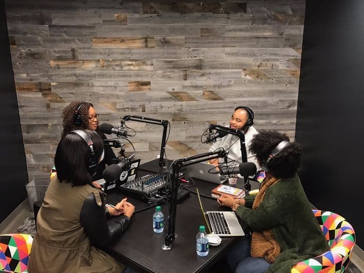 The host and guests having a podcast session